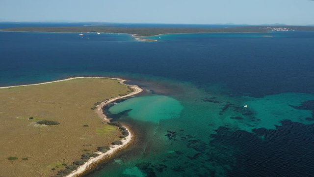 The beautiful blue waters of Olib Island in Croatia on a bright summer day - aerial