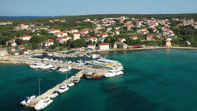 View Of The Small Port Of Olib, Croatia On A Beautiful Sunny Day. Ferry Boat And Yachts Moored At The Pier - aerial shot