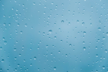 Water drops on a transparent polythene after a rain as a background image. Top view. Copy, empty space for text