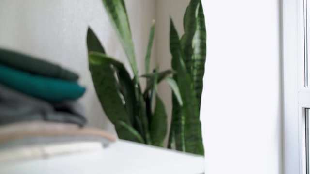 Webcam hidden in a stack of clothes for covert surveillance of the house. Surveillance and security systems. Smart House. Espionage. Hidden camera for watching