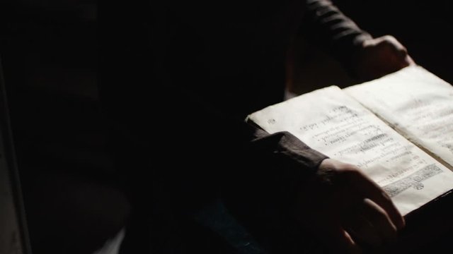 Top voew of Someone is looking for something in the old book