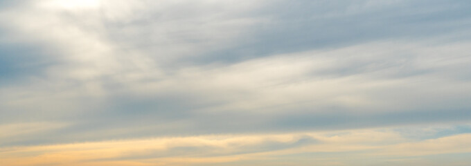 Orange sunset sky with moody clouds