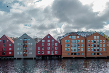 Naklejka premium Trondheim, Norway; May 5 2015: Colorful houses with reflection in the water of Trondheim.