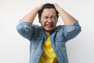 Asian Man Close His Eyes, Stress or Headache Concept
