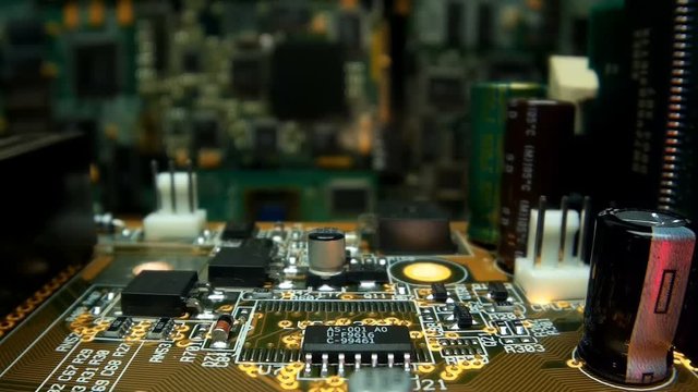 The camera slowly moves over the printed circuit board with main processor, on which seen the entire internal structure of the microchip. A blinking LED indicates data miscalculation. Macro. Closeup. 