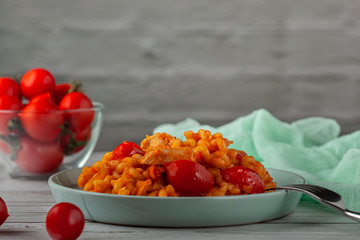 Pasta with cherry tomatoes and basil. Italian food. Italian Cuisine. Homemade food. The concept of tasty and healthy food.