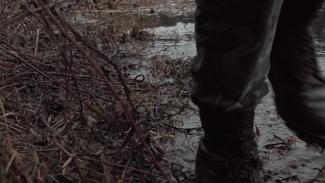 soldier sneaks across the river in slow motion
