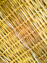 Bamboo dry sheet curtain tied with light wood tone background. Texture