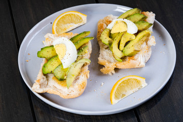 a Filipino bread with toasted garlic butter topped with avocado and egg also known as avocado toast