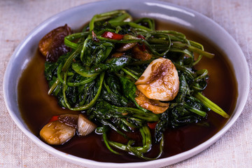 stir fried Chinese spinach or po lun chai with garlic, soy sauce and a little chili