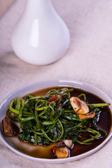 stir fried Chinese spinach or po lun chai with garlic, soy sauce and a little chili