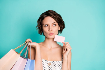 Closeup photo of pretty lady hold wireless payment prime bonus card many store packs look empty...