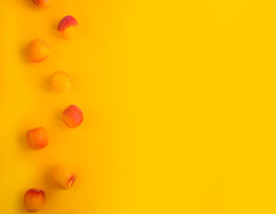 Ripe apricots fruit yellow background