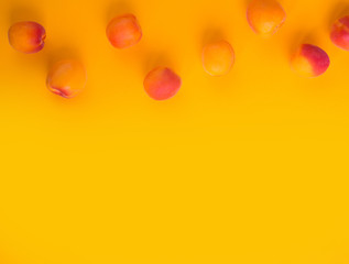 Ripe apricots fruit yellow background