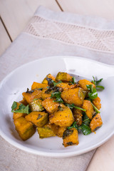 sweet and salty baked pumpkin with fresh rosemary and arugula 