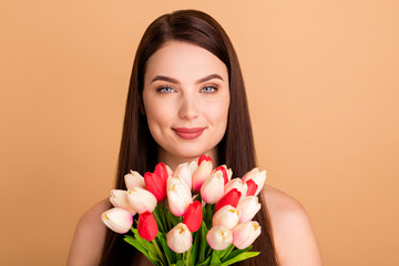 Close up photo of charming girl hold bouquet present for 8-march spring celebration real beauty after collagen procedure spa salon treatment isolated over pastel color background