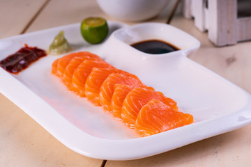 fresh salmon sashimi with wasabi and soy sauce