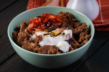 beef bulgogi with kimchi and egg on rice