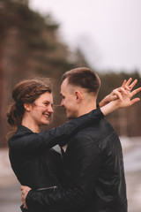 boy and girl are dancing and smiling
