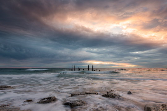 The iconic port willunga jetty ruins at high tide and long exposures located on the Fleurieu Peninsula South Australia on the 26th May 2020
