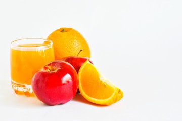Fresh orange juice with oranges and apples on a white background. Place for text.