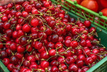 ripe cherries at the grocery market close up. Sale of products.