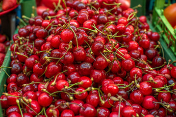 ripe cherries at the grocery market close up. Sale of products.