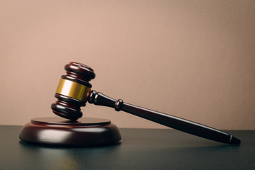Symbol of law and justice on wooden table in lawyer office