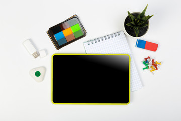 Digital Tablet mockup and stationery on a white table. Flat lay.