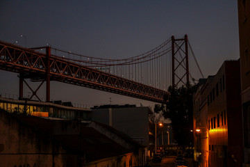 Night view of the famous 25th of April bridge in Lisbon over the city