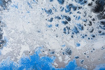 Acrylic  abstract background. Blue paint with silver