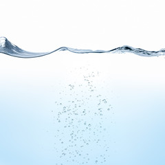 Rippling water surface with bubbles against white background