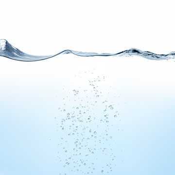 Rippling water surface with bubbles against white background