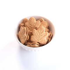 Canadian maple cookies in white caramic bowl isolated on white background
