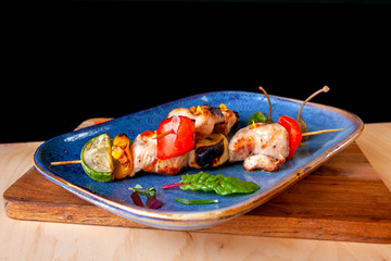 grilled meat and vegetables on wooden skewers