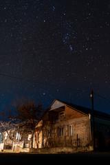 Armenia, autumn, 2019: old hut in the night with sky full of stars
