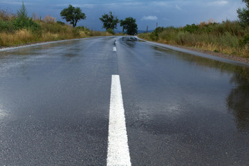 Wet empty road after storm