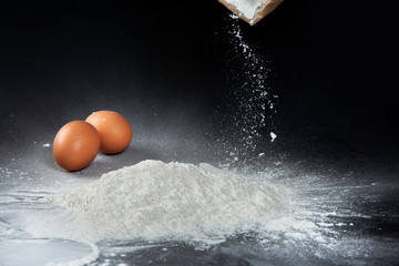 Flour texture on Cooking table background. Homemade professional kitchen Making bread with flour and eggs . Flour for cooking Dessert Homemade concept.