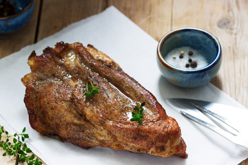 Baked pork shoulder on the bone with spices, herbs and aromatic oil.