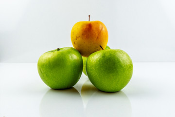 Yellow and green apples isolated on white background