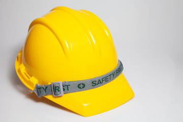Fototapeta premium Yellow safety helmet on white background. Hard Hat or safety engineer helmet for construction site