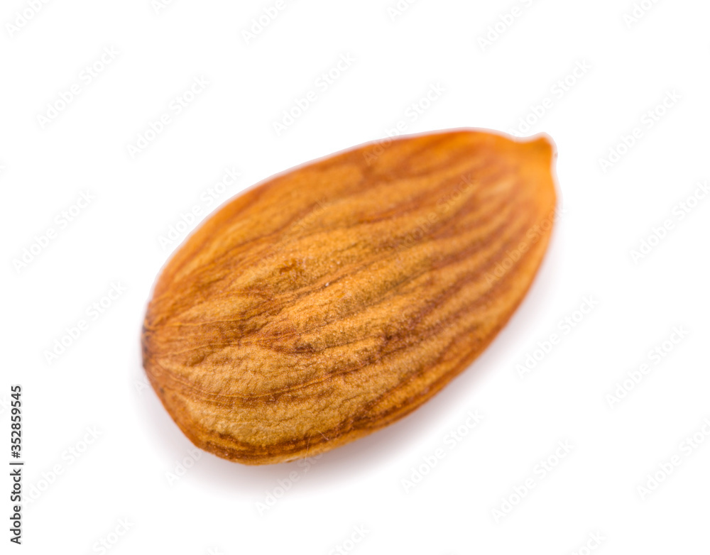 Wall mural one almond nut an isolated on white background