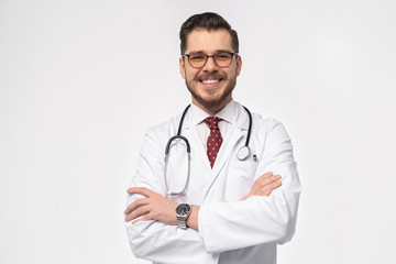 Fototapeta premium Smiling medical doctor. Isolated over white background.