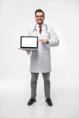 Smiling medical doctor. Isolated over white background.
