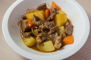 A bowl of nikujaga, beef and potato stew.