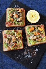 Healthy toasts with avocado pasta and mussels. Proper nutrition. Healthy breakfast or snack.