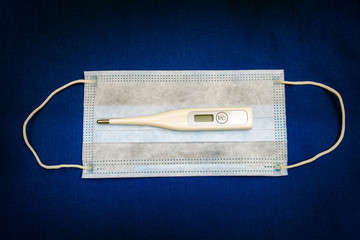 Flu Mask with a Thermometer