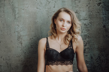 Portrait of sexy glamour woman wearing in elegant black lingerie. Woman looking in camera