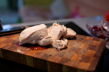 chopped boiled chicken on a wooden board