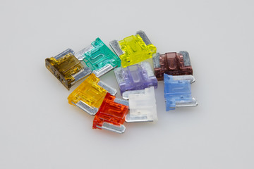 car fuse of different amperes and colors.